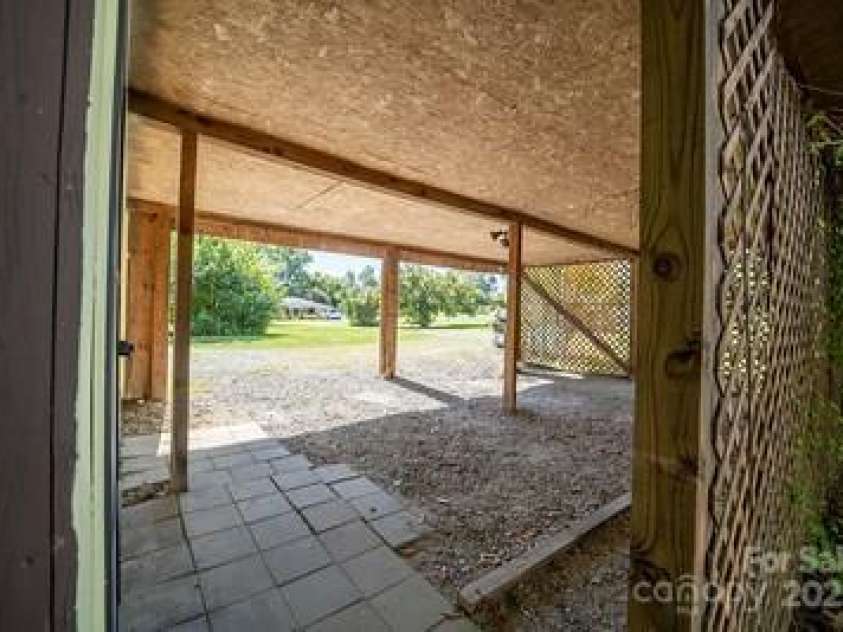 116 Bradshaw Avenue, Hendersonville, NC 28792.  MLS# CAR4179675, YatesRealty ID 8970. 2 car carport