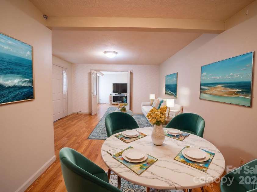 116 Bradshaw Avenue, Hendersonville, NC 28792.  MLS# CAR4179675, YatesRealty ID 8970. Living and Dining areas staged