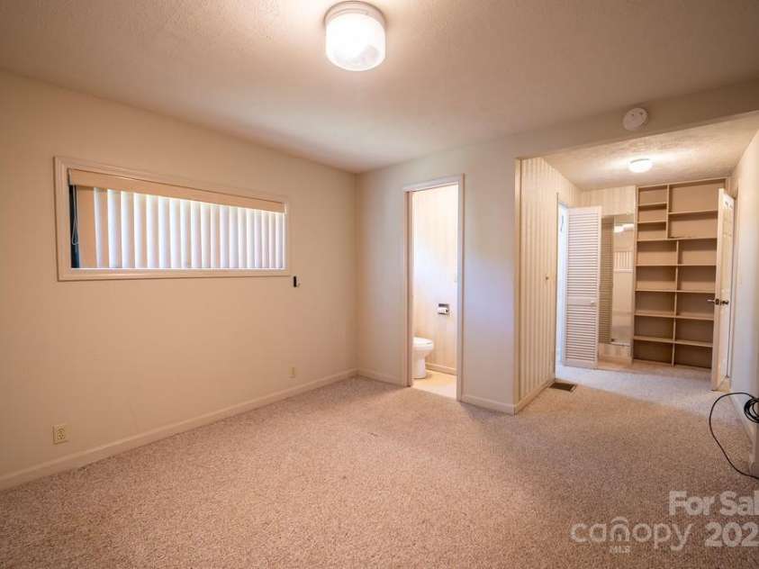 116 Bradshaw Avenue, Hendersonville, NC 28792.  MLS# CAR4179675, YatesRealty ID 8970. Primary bedroom and half bath