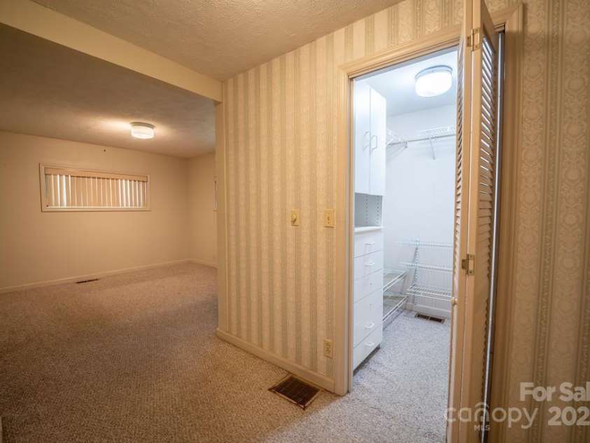 116 Bradshaw Avenue, Hendersonville, NC 28792.  MLS# CAR4179675, YatesRealty ID 8970. Primary bedroom and walk in closet