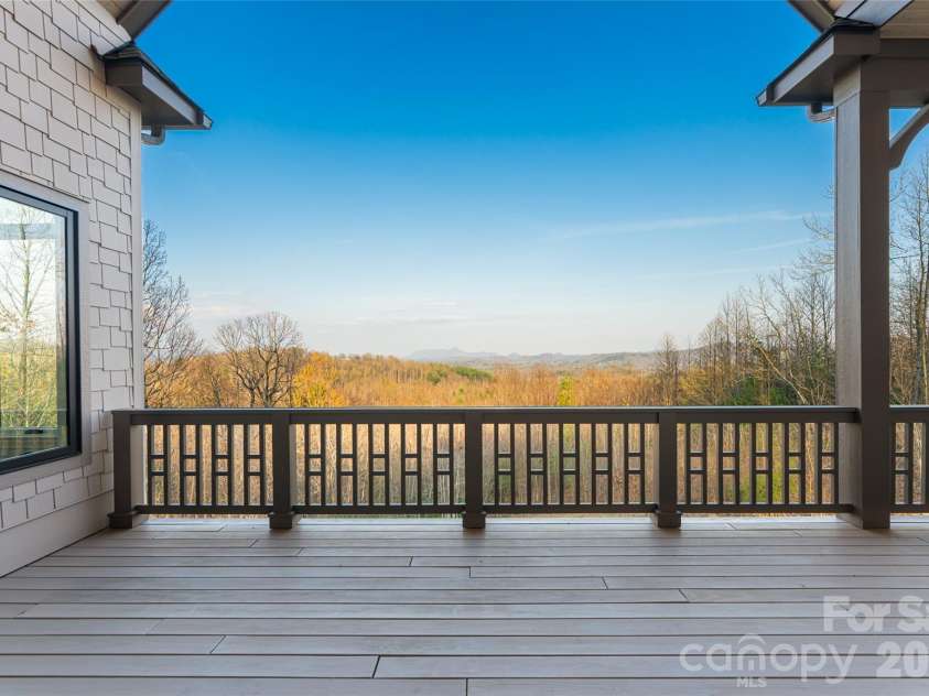 527 Falkirk Way, Zirconia, NC 28790.  MLS# CAR4364609, YatesRealty ID 8977. Back Deck off Great Room and Primary Bedroom