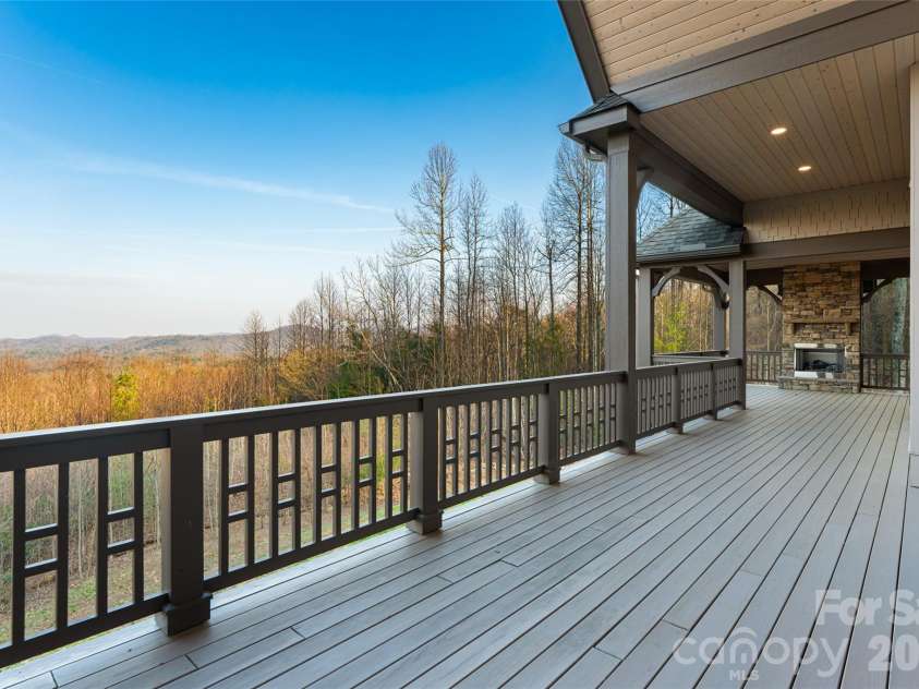 527 Falkirk Way, Zirconia, NC 28790.  MLS# CAR4364609, YatesRealty ID 8977. Back Deck off Great Room and Primary Bedroom