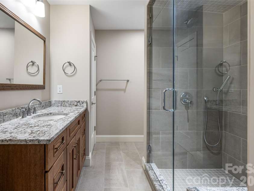527 Falkirk Way, Zirconia, NC 28790.  MLS# CAR4364609, YatesRealty ID 8977. Lower Level Bath with Steam Shower