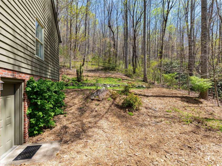 723 Merrills Cove Road, Asheville, NC 28803.  MLS# CAR4249299, YatesRealty ID 8978. Side Yard / Basement Entry