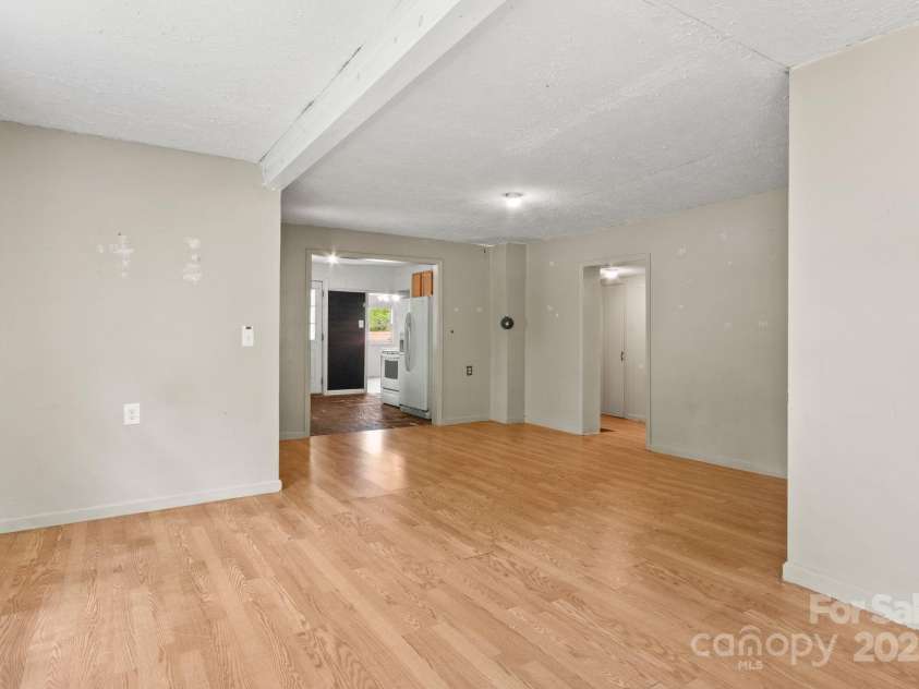 412 Trammell Avenue, Canton, NC 28716.  MLS# CAR4249273, YatesRealty ID 8979. Living room showing kitchen entrance