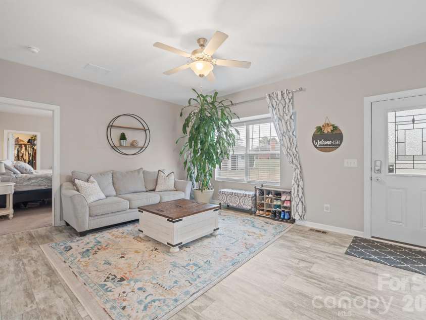 486 Stutts Road, Mooresville, NC 28117.  MLS# CAR4329027, YatesRealty ID 8982. Den has nice natural light from front windows