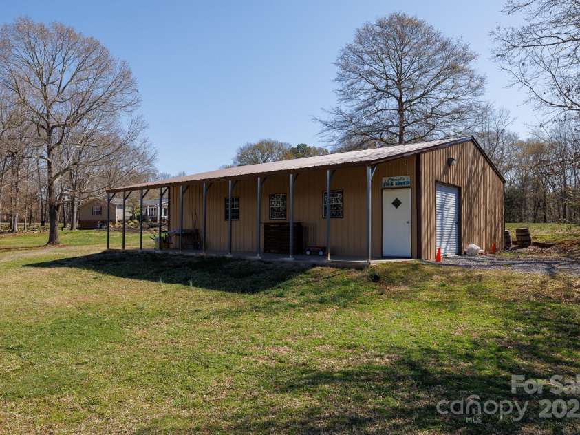 4229 Motocross Trail, Edgemoor, SC 29712.  MLS# CAR4238485, YatesRealty ID 8991. And another-Spacious workshop dreams! Create and conquer all your projects in style.