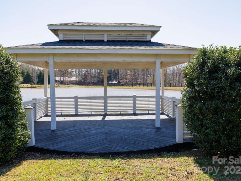 4229 Motocross Trail, Edgemoor, SC 29712.  MLS# CAR4238485, YatesRealty ID 8991. Charming gazebo overlooking a serene stocked pond—perfect for peaceful reflections or lively celebrations.
