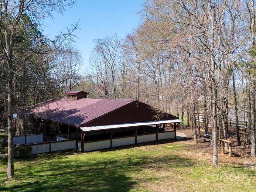 4229 Motocross Trail, Edgemoor, SC 29712.  MLS# CAR4238485, YatesRealty ID 8991. Charming pavilion nestled in lush greenery—perfect for unforgettable outdoor gatherings or weddings.
