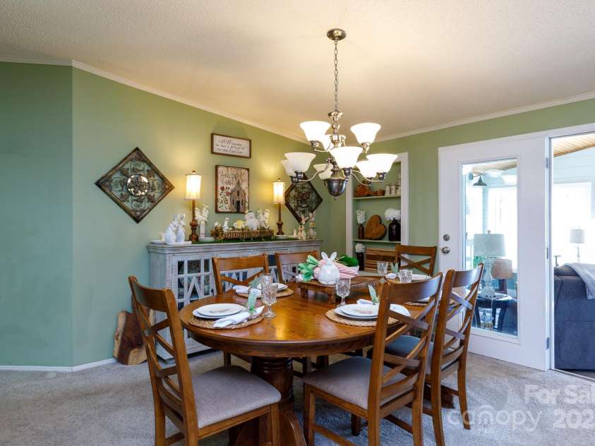 4229 Motocross Trail, Edgemoor, SC 29712.  MLS# CAR4238485, YatesRealty ID 8991. Cozy dining area perfect for entertaining with a charming blend of style and comfort.