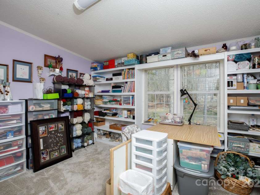4229 Motocross Trail, Edgemoor, SC 29712.  MLS# CAR4238485, YatesRealty ID 8991. Craft room in primary bedroom. Creative space with abundant storage, perfect for crafting your next masterpiece or organizing treasures.