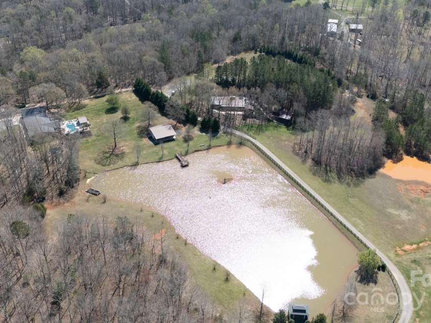 4229 Motocross Trail, Edgemoor, SC 29712.  MLS# CAR4238485, YatesRealty ID 8991. Discover serenity on 33 private acres featuring a stocked pond perfect for peaceful afternoons. This expansive outdoor space is your ideal canvas for weddings and memorable gatherings amidst nature's embrace.