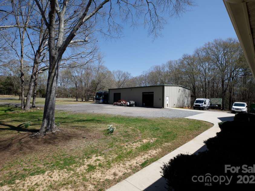 4229 Motocross Trail, Edgemoor, SC 29712.  MLS# CAR4238485, YatesRealty ID 8991. Expansive outdoor space with a versatile workshop that has ample storage and a large commercial kitchen.