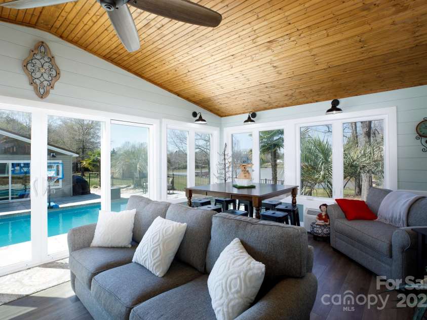 4229 Motocross Trail, Edgemoor, SC 29712.  MLS# CAR4238485, YatesRealty ID 8991. Relax in a sunlit haven with serene views of the pool and garden paradise.