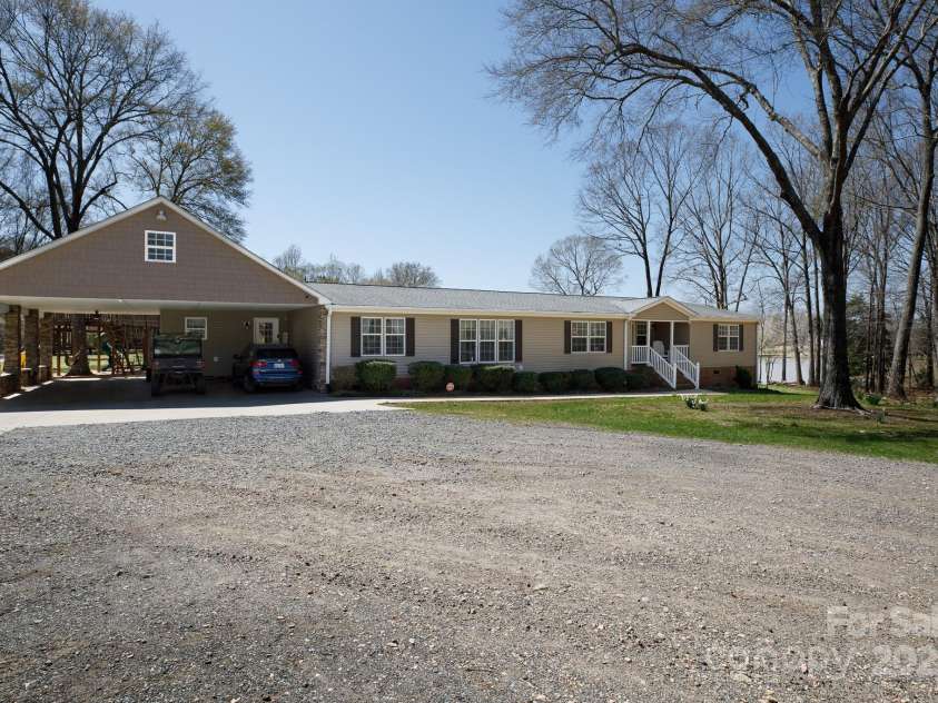 4229 Motocross Trail, Edgemoor, SC 29712.  MLS# CAR4238485, YatesRealty ID 8991. Spacious ranch home with carport and serene wooded surroundings, ideal for your dream retreat.