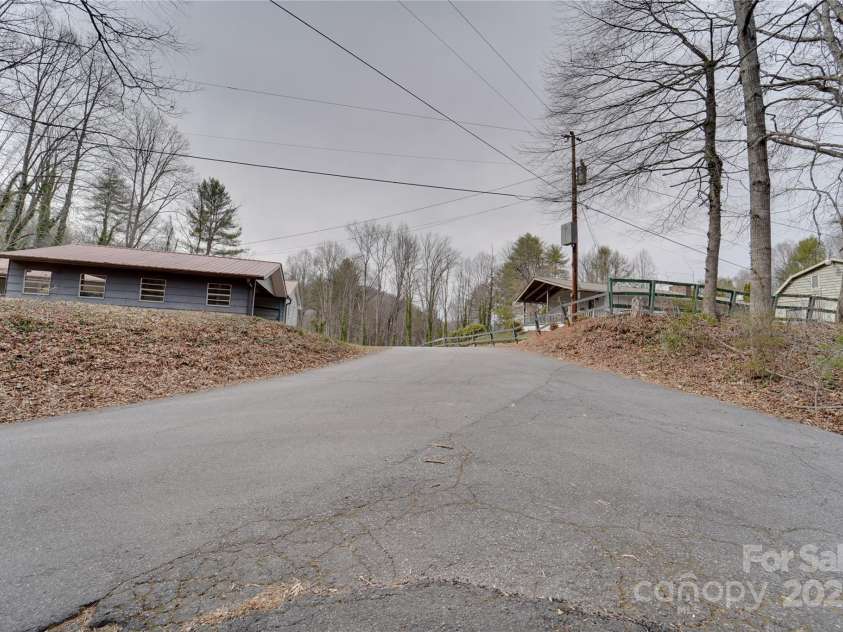 1 Virginia Lane, Cullowhee, NC 28723.  MLS# CAR4238066, YatesRealty ID 8994. Road view