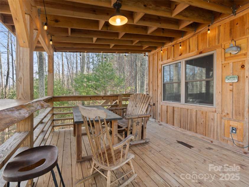 2504 Upper Paw Paw Road, Marshall, NC 28753.  MLS# CAR4214272, YatesRealty ID 9002. Eating Area On Front Porch
