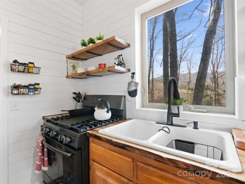 2504 Upper Paw Paw Road, Marshall, NC 28753.  MLS# CAR4214272, YatesRealty ID 9002. Propane stove, double sink
