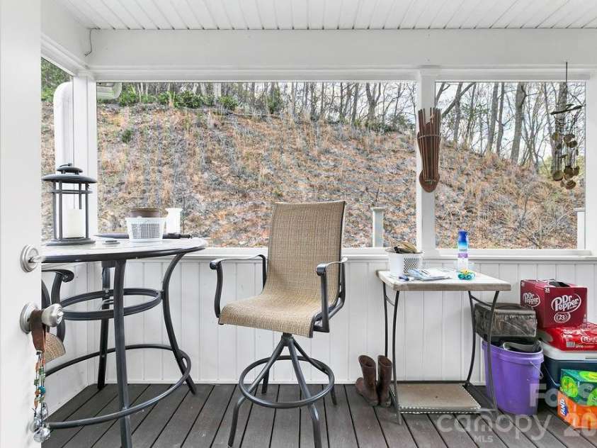 410 Forest Lake Road, Brevard, NC 28712.  MLS# CAR4364087, YatesRealty ID 9011. Back Screened Porch