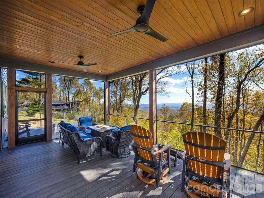 15 Laurel Ledge Way, Fletcher, NC 28732.  MLS# CAR4316029, YatesRealty ID 9014. A place for everyone on this massive covered deck.