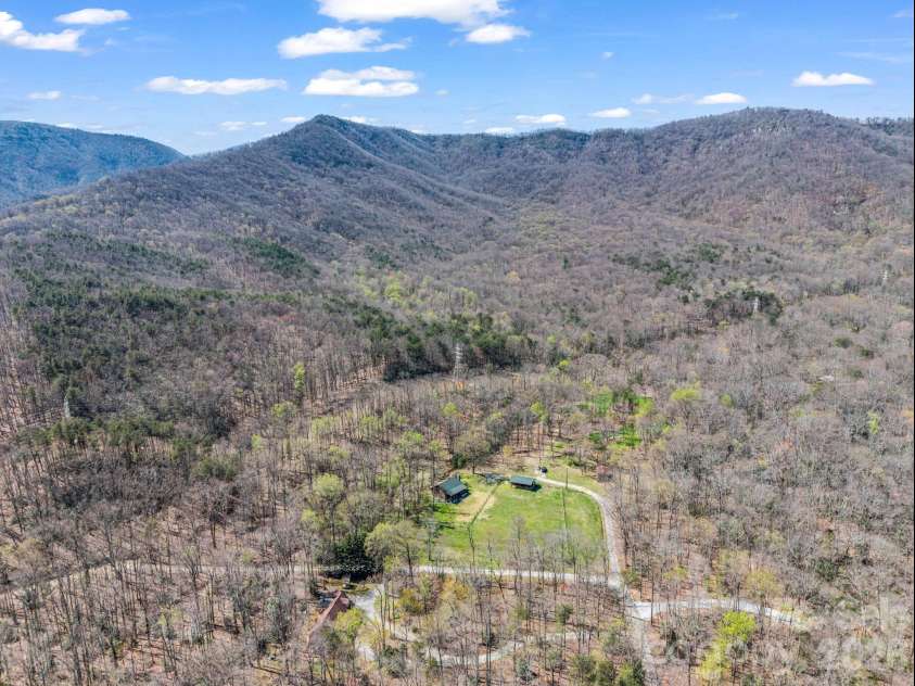 175 Pink Campbell Road, Landrum, SC 29356.  MLS# CAR4359870, YatesRealty ID 9018. 5 acres surrounded by mountains, conservancy land on the left.