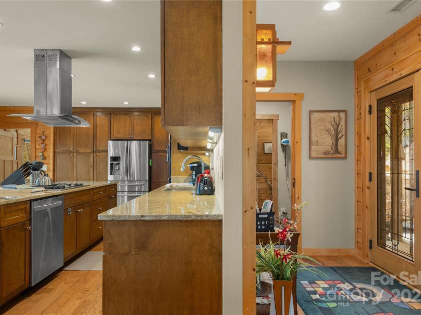 263 Mine Cove Road, Spruce Pine, NC 28777.  MLS# CAR4244163, YatesRealty ID 9018. Viewing the divider between Foyer and Kitchen.