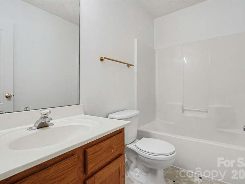 205 Amir Circle, Matthews, NC 28105.  MLS# CAR4356805, YatesRealty ID 9020. Hall Bathroom