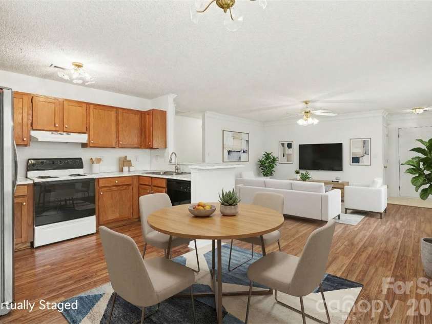 205 Amir Circle, Matthews, NC 28105.  MLS# CAR4356805, YatesRealty ID 9020. Virtual staging dinning 