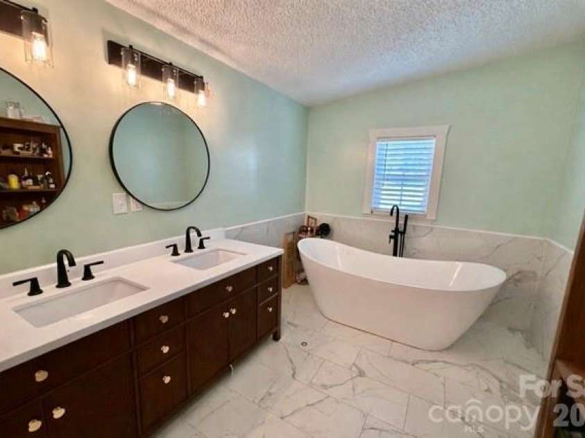 119 Grant Lane, Saluda, NC 28773.  MLS# CAR4360220, YatesRealty ID 9048. Spa like master bath