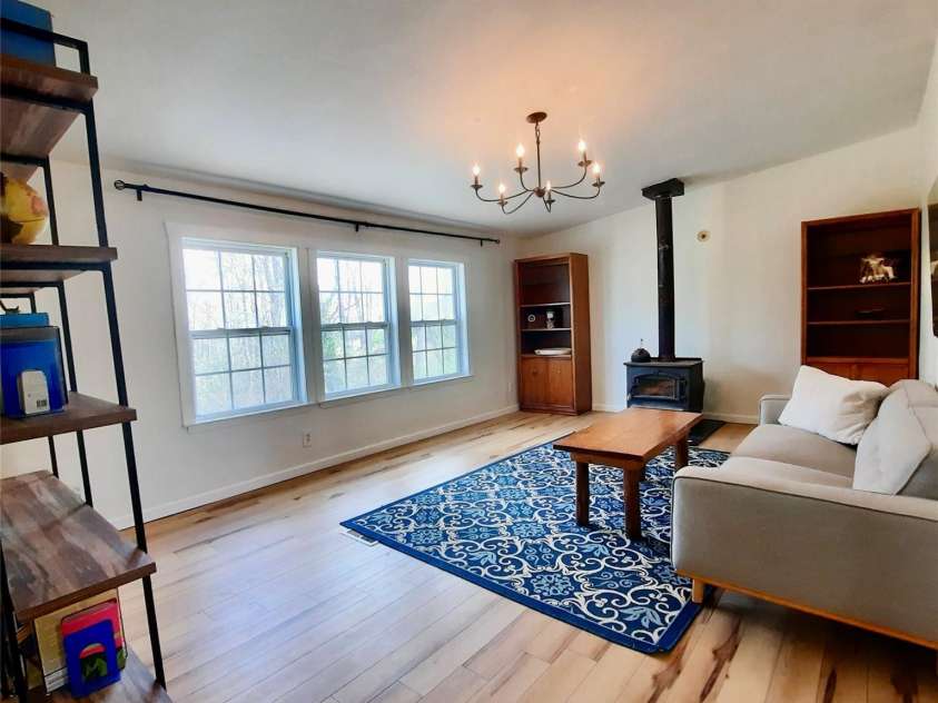 119 Grant Lane, Saluda, NC 28773.  MLS# CAR4360220, YatesRealty ID 9048. Wood Burning stove