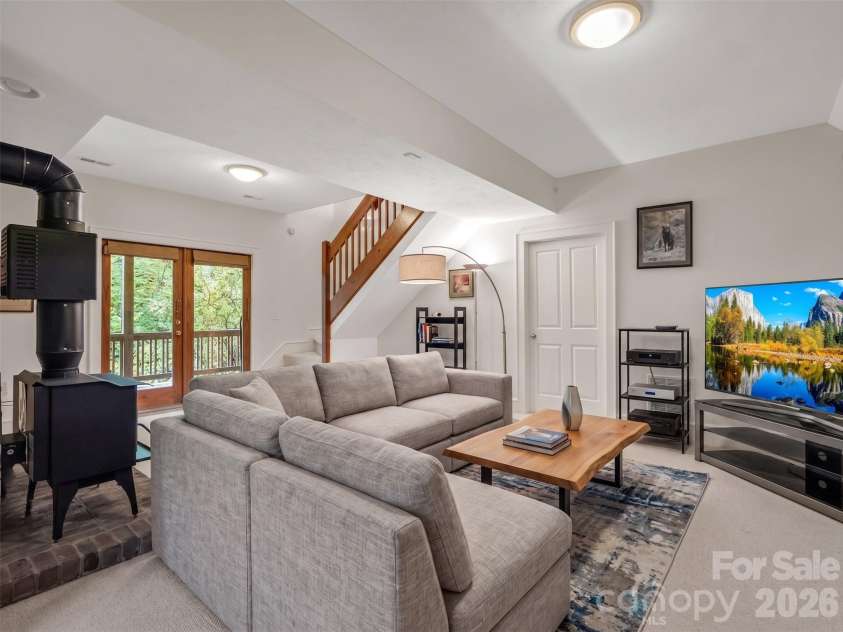 142 Winterview Trail, Hendersonville, NC 28739.  MLS# CAR4300750, YatesRealty ID 9056. Basement Living room / mulitpurpose. Virtually staged