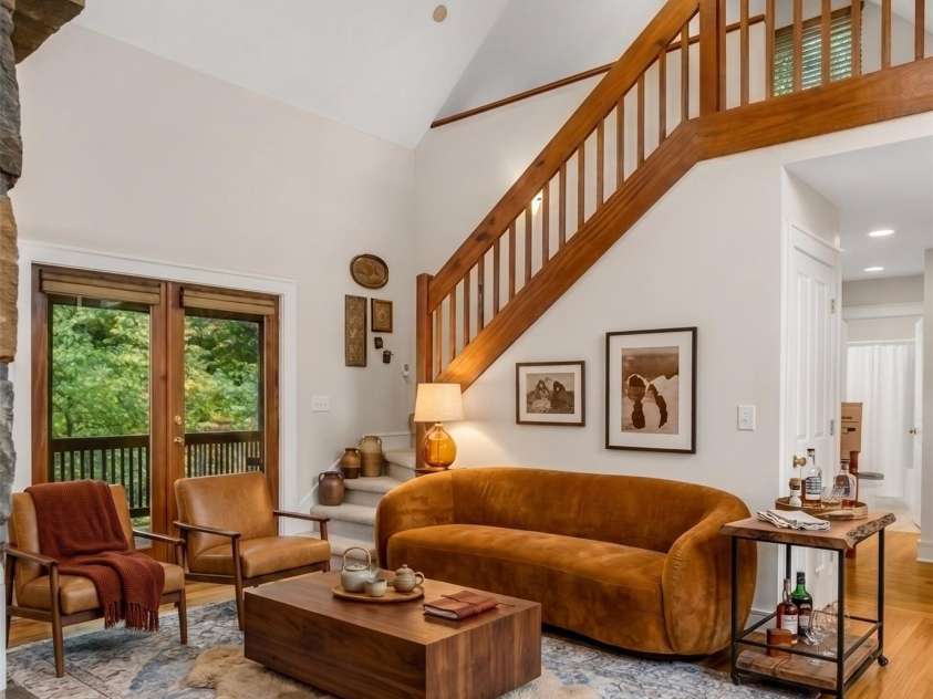 142 Winterview Trail, Hendersonville, NC 28739.  MLS# CAR4300750, YatesRealty ID 9056. Virtually staged main level living room
