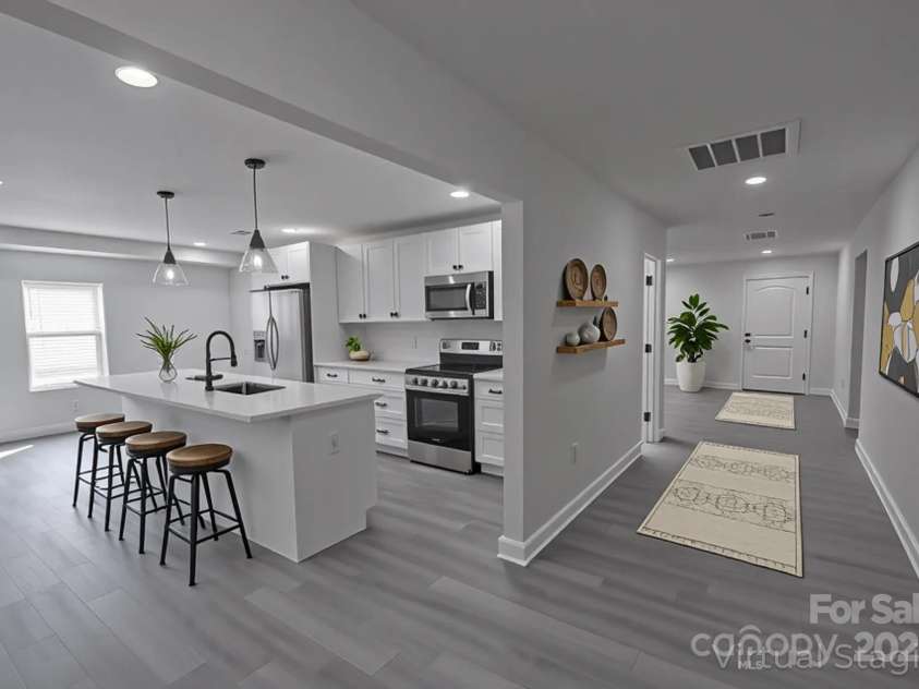 116 11th Street, Spencer, NC 28159.  MLS# CAR4228313, YatesRealty ID 9058. Hallway/Kitchen Staged