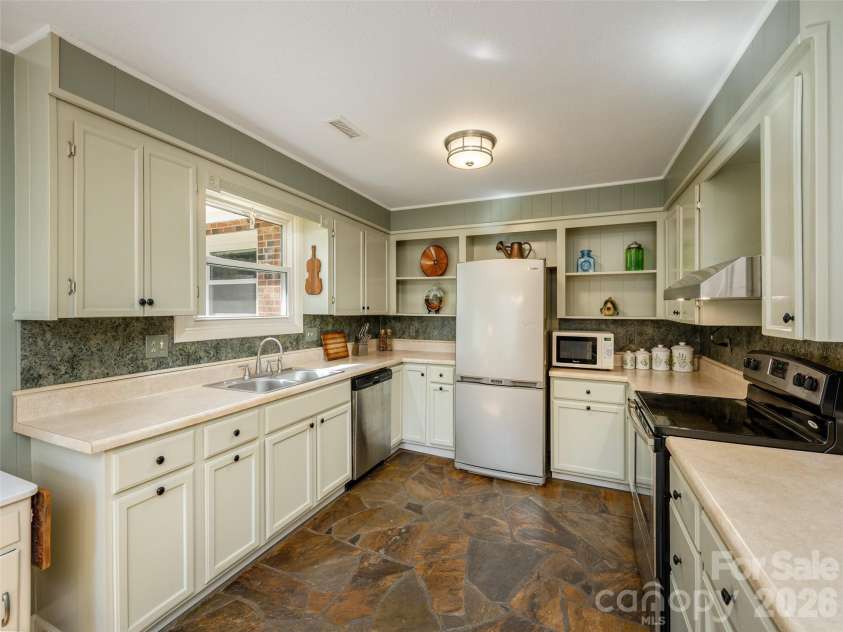 54 Bear Rock Loop Road, Hendersonville, NC 28739.  MLS# CAR4361191, YatesRealty ID 9062. Kitchen with loads of Storage