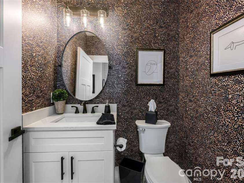 99 Timber Ridge Circle, Leicester, NC 28748.  MLS# CAR4364213, YatesRealty ID 9071. Half bath on the main level, for guests.