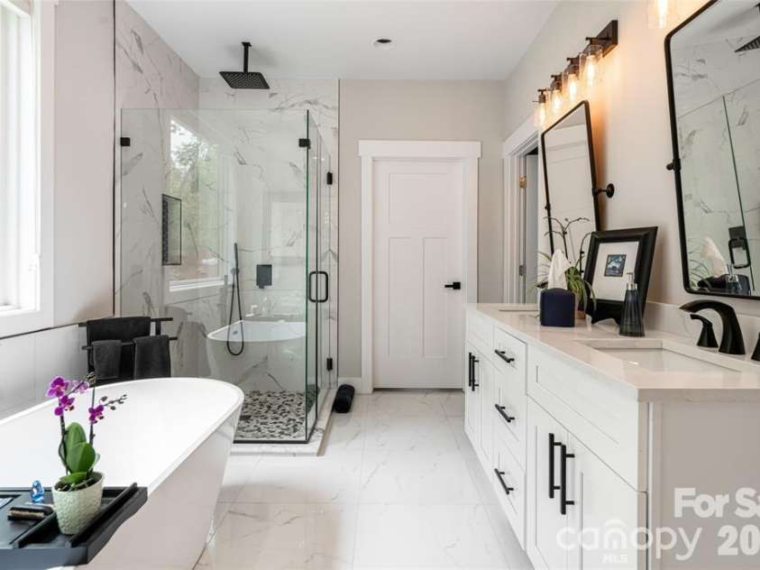 99 Timber Ridge Circle, Leicester, NC 28748.  MLS# CAR4364213, YatesRealty ID 9071. Primary Bath with spacious finishes and a walk-in closet.
