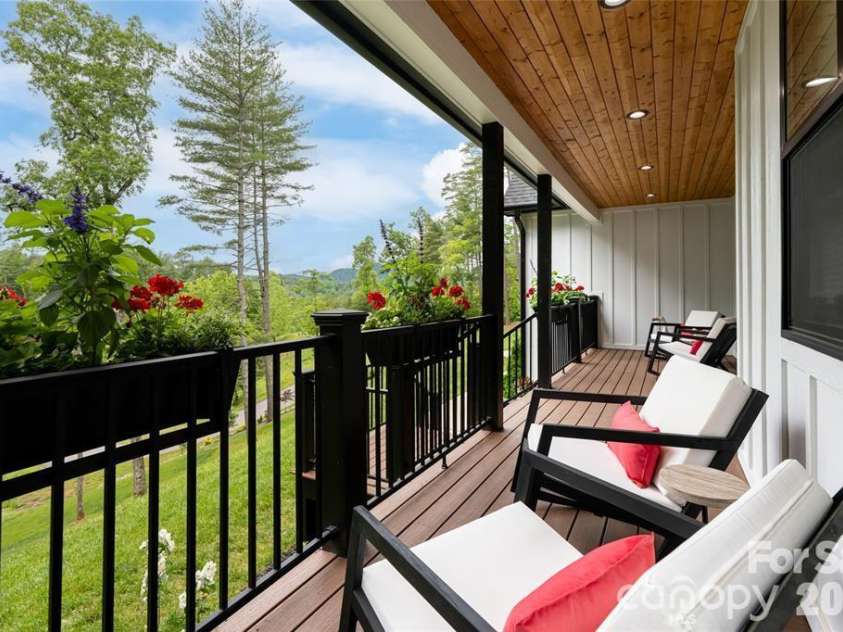 99 Timber Ridge Circle, Leicester, NC 28748.  MLS# CAR4364213, YatesRealty ID 9071. Relaxing views and inviting front porch.