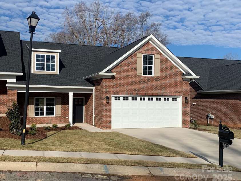 118 Abbington Lane, Shelby, NC 28150.  MLS# CAR4153289, YatesRealty ID 9083. This brand new brick townhome has a 2 car garage and a quaint front porch.