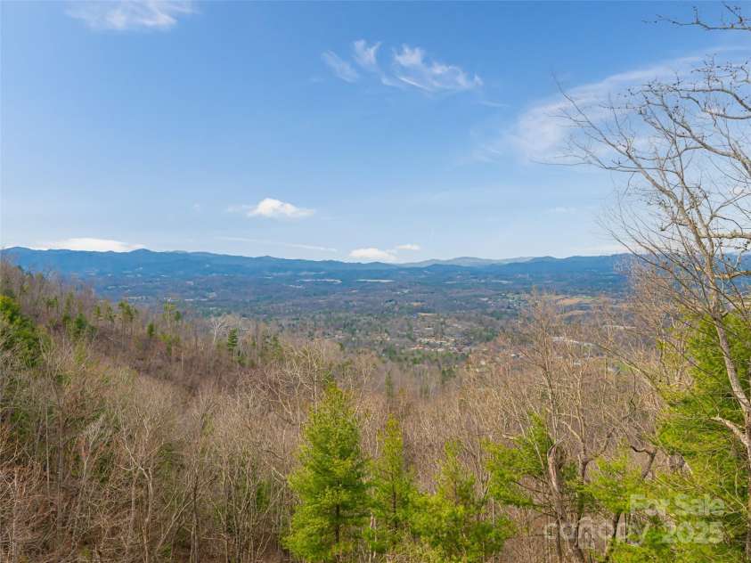 21 Alta Citta Lane, Asheville, NC 28804.  MLS# CAR4241580, YatesRealty ID 9090. Distant mountain views ever changing with the weather