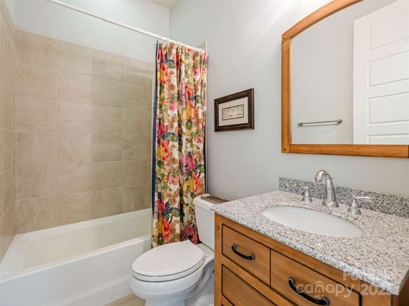21 Alta Citta Lane, Asheville, NC 28804.  MLS# CAR4241580, YatesRealty ID 9090. One of two guest bathrooms on lower level