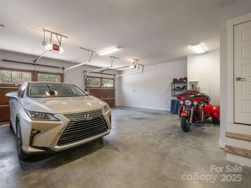 21 Alta Citta Lane, Asheville, NC 28804.  MLS# CAR4241580, YatesRealty ID 9090. Oversized garage offers plenty of room