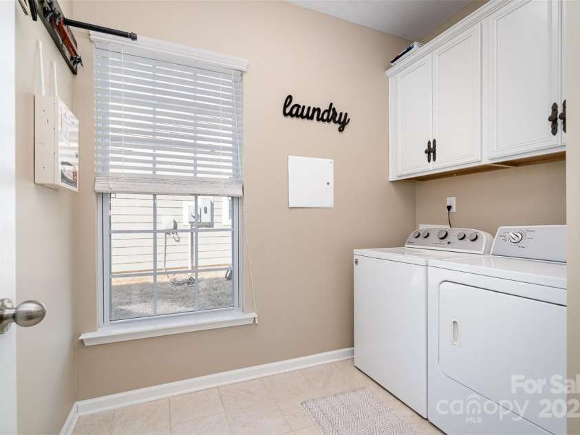 6187 Cloverdale Drive, Tega Cay, SC 29708.  MLS# CAR4226787, YatesRealty ID 9094. Laundry on main, built in cabinets