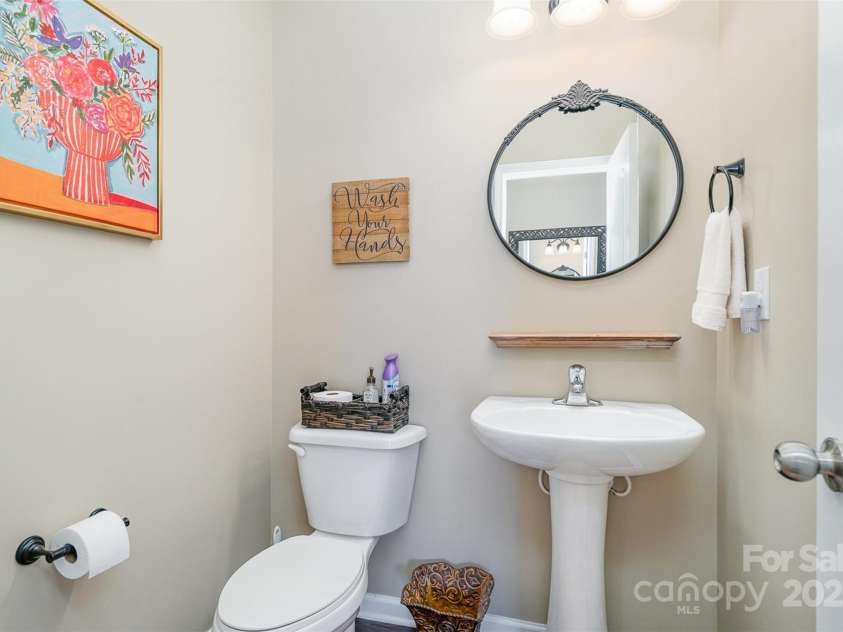 6187 Cloverdale Drive, Tega Cay, SC 29708.  MLS# CAR4226787, YatesRealty ID 9094. Main half bath, pedestal sink