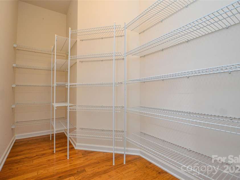 9332 Whistling Straits Drive, Fort Mill, SC 29707.  MLS# CAR4332758, YatesRealty ID 9098. Large walk in pantry off kitchen