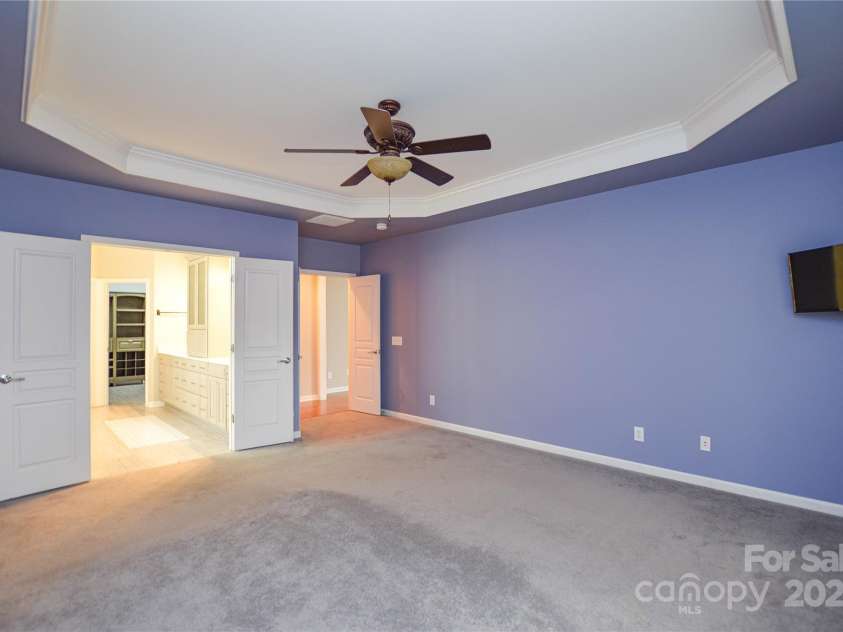 9332 Whistling Straits Drive, Fort Mill, SC 29707.  MLS# CAR4332758, YatesRealty ID 9098. Primary bedroom towards ensuite bath area