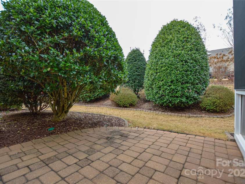9332 Whistling Straits Drive, Fort Mill, SC 29707.  MLS# CAR4332758, YatesRealty ID 9098. Private patio off screened porch for outdoor grilling
