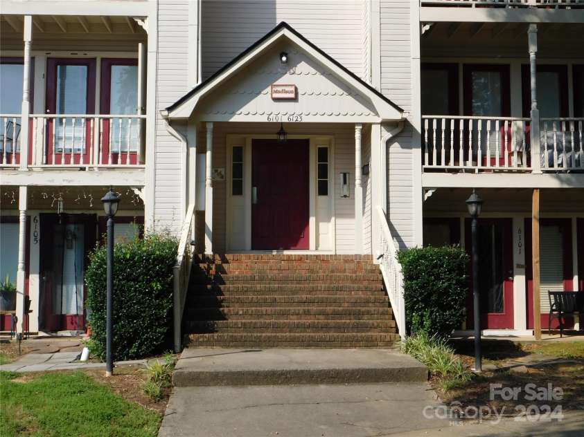 6117 Meadow Rose Lane, Charlotte, NC 28215.  MLS# CAR4173354, YatesRealty ID 910. Front of condo building entrance