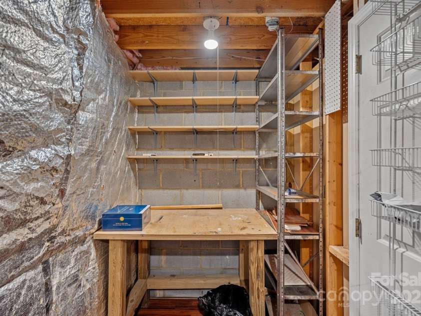 218 Water Oak Drive, Pineville, NC 28134.  MLS# CAR4269625, YatesRealty ID 9103. Work bench and storage in laundry room