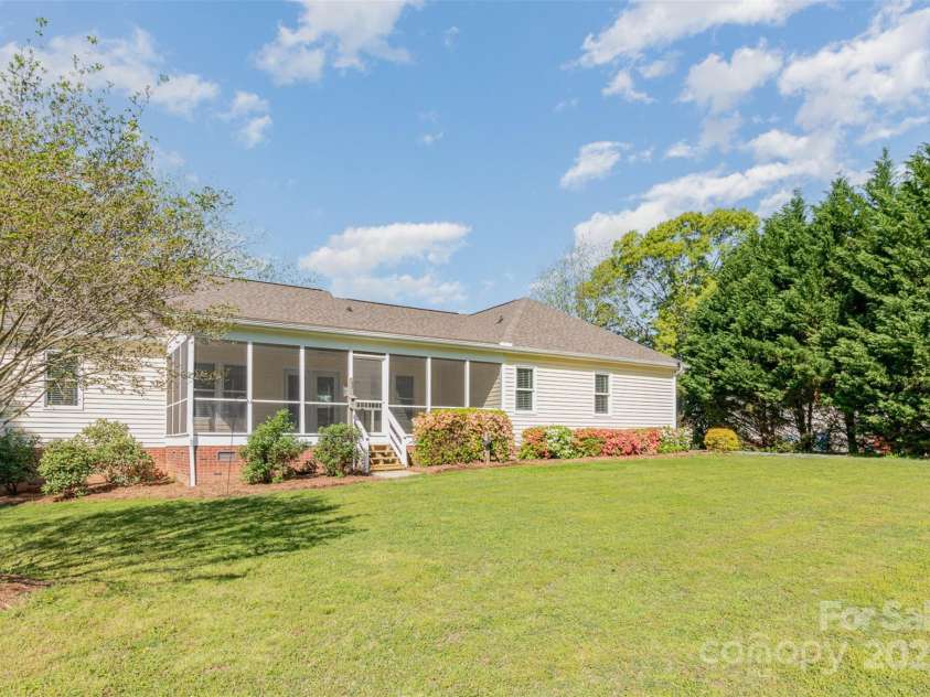 202 Oakwood Street, Stanfield, NC 28163.  MLS# CAR4224991, YatesRealty ID 9104. Back of Home with Screened Porch
