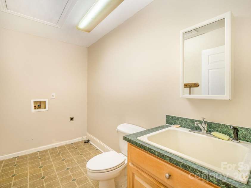 202 Oakwood Street, Stanfield, NC 28163.  MLS# CAR4224991, YatesRealty ID 9104. Half Bath and Laundry